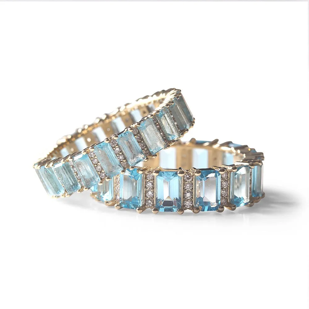 BLUE TOPAZ AND DIAMOND BAGUETTE CUT ETERNITY BAND