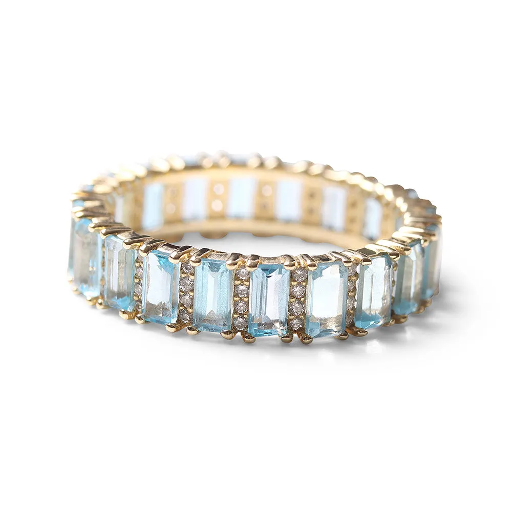 BLUE TOPAZ AND DIAMOND BAGUETTE CUT ETERNITY BAND