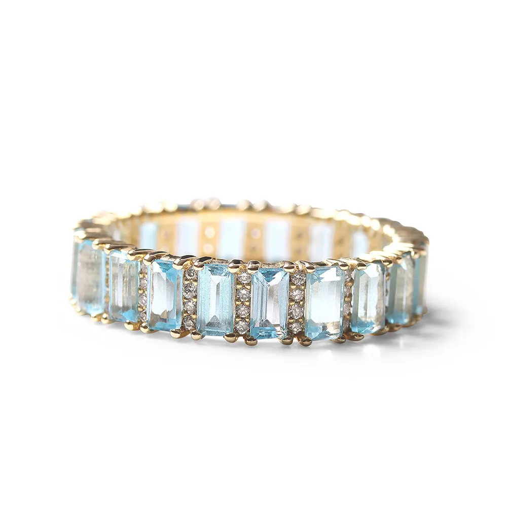 BLUE TOPAZ AND DIAMOND BAGUETTE CUT ETERNITY BAND