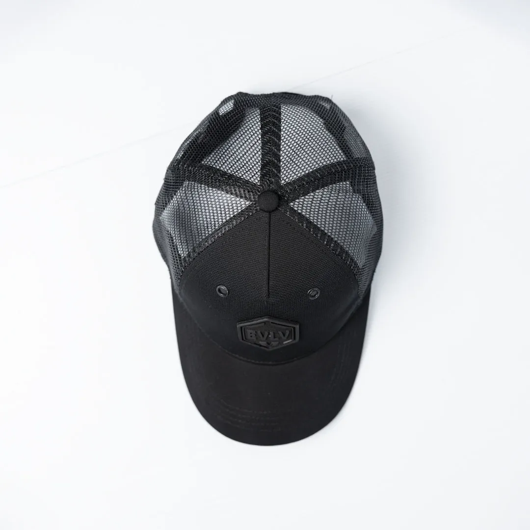 Evolve Black Polyester Trucker Cap.Rubber Badge.